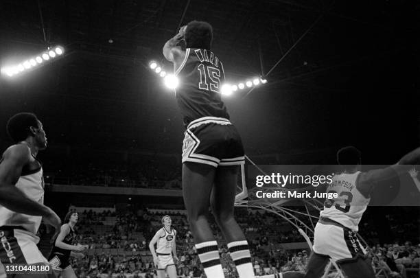 San Antonio Spurs guard Henry Ward shoots a pull-up jumper over David Thompson during an ABA game against the Denver Nuggets at McNichols Arena on...