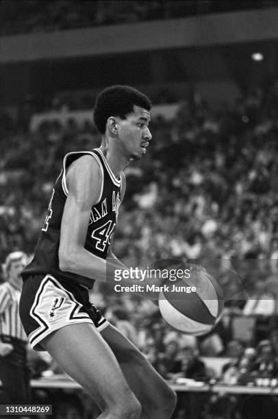 San Antonio Spurs forward George Gervin dribbles toward the basket during an ABA game against the Denver Nuggets at McNichols Arena on January 23,...