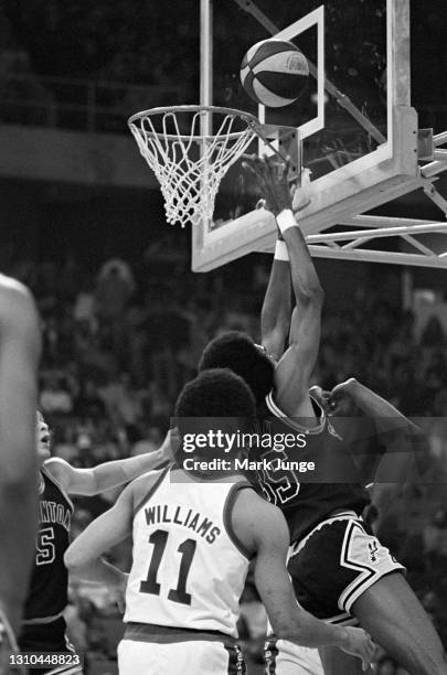 San Antonio Spurs forward Larry Kenon drives past Chuck Williams for a layup during an ABA game against the Denver Nuggets at McNichols Arena on...