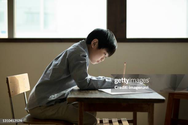 boy transcribing - japanese people lesson english stock pictures, royalty-free photos & images