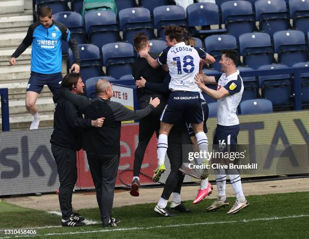 Brad Potts of Preston North End celebrates with Andrew Hughes, Ryan Ledson and team mates after scoring their side's first goal during the Sky Bet...