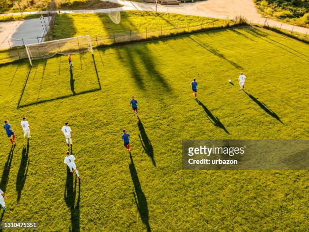 soccer players playing football - soccer championship stock pictures, royalty-free photos & images