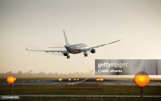 3d render of a passenger airplane landing on runway - landing touching down stock pictures, royalty-free photos & images