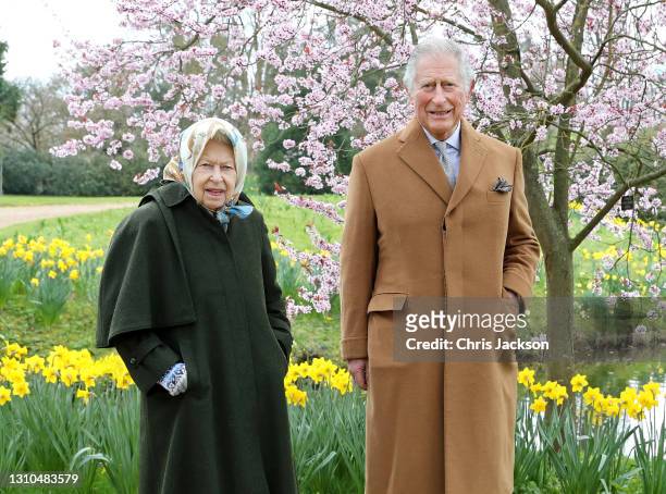 In this image released on April 2 Queen Elizabeth II and Prince Charles, Prince of Wales pose for a portrait in the garden of Frogmore House, on...