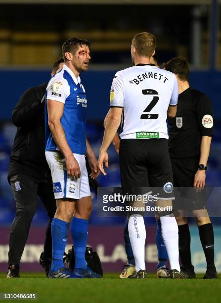 Lukas Jutkiewicz of Birmingham City is seen with a cut on his face after a challenge with Ryan Bennett of Swansea City during the Sky Bet...