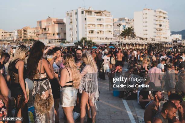 sunset party scene in san antonio, ibiza - ibiza party stock pictures, royalty-free photos & images