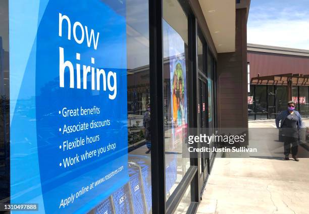 Pedestrian walks by a now hiring sign at Ross Dress For Less store on April 02, 2021 in San Rafael, California. According to a report by the Bureau...