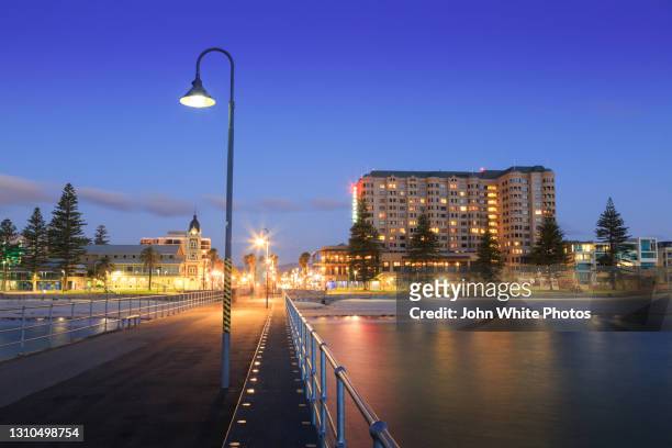 glenelg jetty and foreshore. south australia. - bay adelaide stock pictures, royalty-free photos & images
