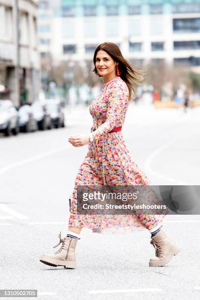 Media Manager and wife of German actor Oliver Franck Anita Franck, wearing a red patterned summer dress with a elt by Hermes, beide boots by Bianco,...