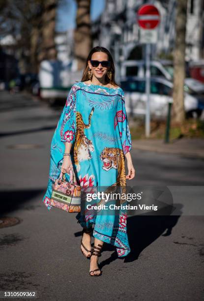 Alexandra Lapp is seen wearing SIMONE BRUNS Tiger silk tunic in cyne, CHRISTIAN DIOR medium Lady D-Lite bag in light multicolor embroidery, BOTTEGA...