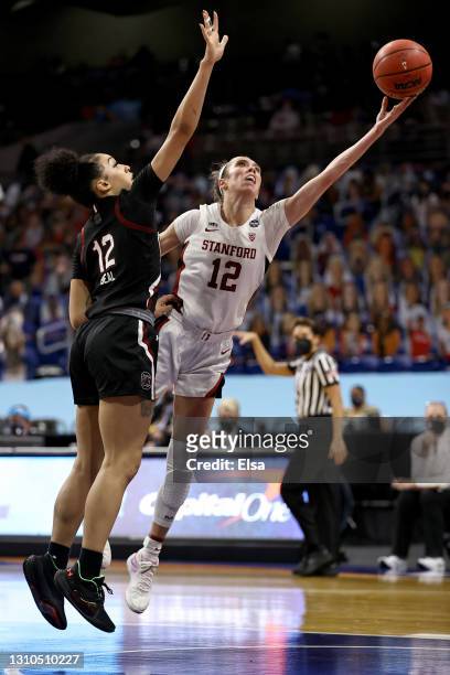Lexie Hull of the Stanford Cardinal shoots under Brea Beal of the South Carolina Gamecocks during the third quarter in the Final Four semifinal game...