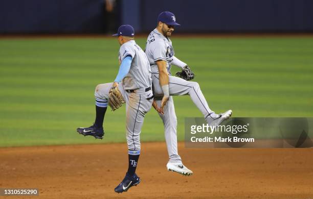 Willy Adames and Kevin Kiermaier of the Tampa Bay Rays celebrate the win against the Miami Marlins at loanDepot park on April 02, 2021 in Miami,...