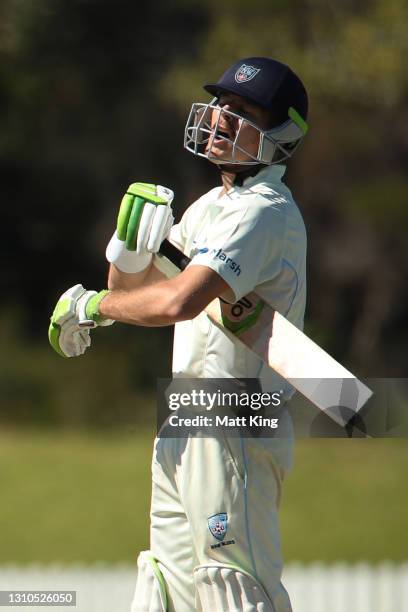 Daniel Hughes of New South Wales reacts after being dismissed by Michael Neser of Queensland during day one of the Sheffield Shield match between New...