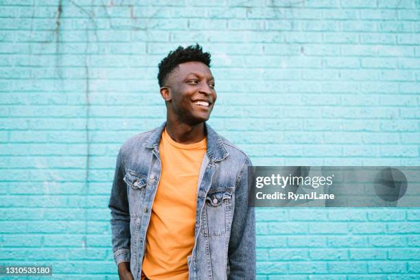 cheerful fashionable adult man in city setting - homem de azul imagens e fotografias de stock