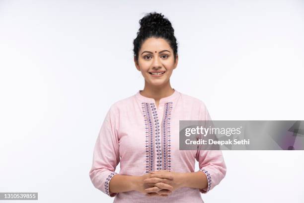 portrait of a young women standing isolated over white background:- stock photo - indian subcontinent ethnicity stock pictures, royalty-free photos & images