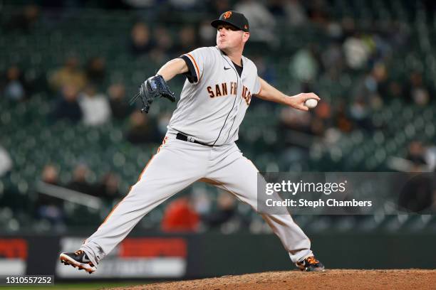 Jake McGee of the San Francisco Giants pitches in the ninth inning against the Seattle Mariners at T-Mobile Park on April 02, 2021 in Seattle,...