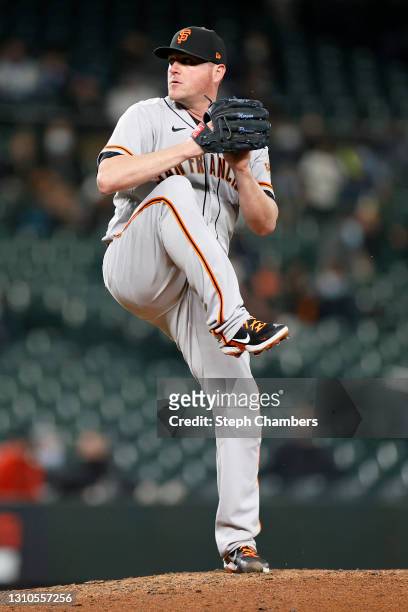 Jake McGee of the San Francisco Giants pitches in the ninth inning against the Seattle Mariners at T-Mobile Park on April 02, 2021 in Seattle,...