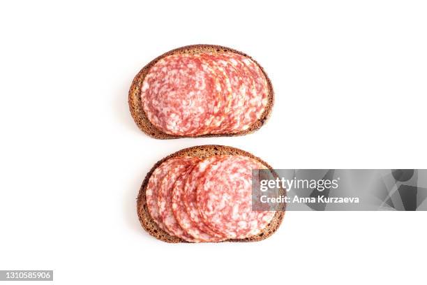 sliced salami on rye bread isolated on white background - sliced white bread isolated stock pictures, royalty-free photos & images