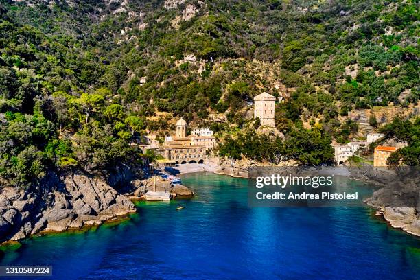 san fruttuoso abbey on portofino promontorium, italy - abbazia foto e immagini stock