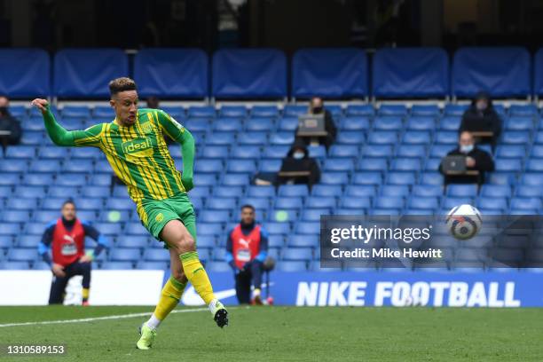 Callum Robinson of West Bromwich Albion scores their team's third goal during the Premier League match between Chelsea and West Bromwich Albion at...