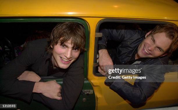 Actors Ashton Kutcher, left, and Seann William Scott arrive at the premiere of his new film "Dude, Where''s my Car?" in the Renault car used in the...