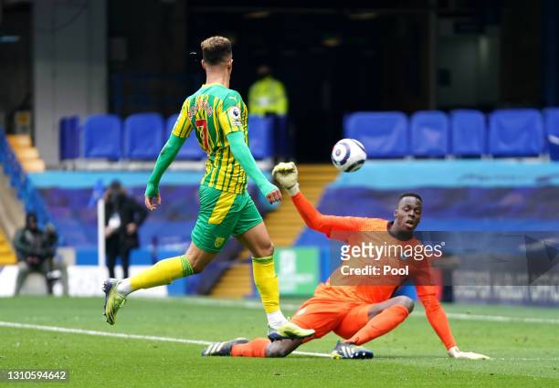 Callum Robinson of West Bromwich Albion scores their side's fifth goal over Edouard Mendy of Chelsea during the Premier League match between Chelsea...