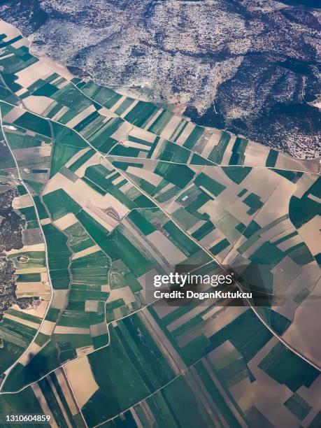 aerial view of cultivated agricultural farming land , mountain with vivid green color - nigeria landscape stock pictures, royalty-free photos & images