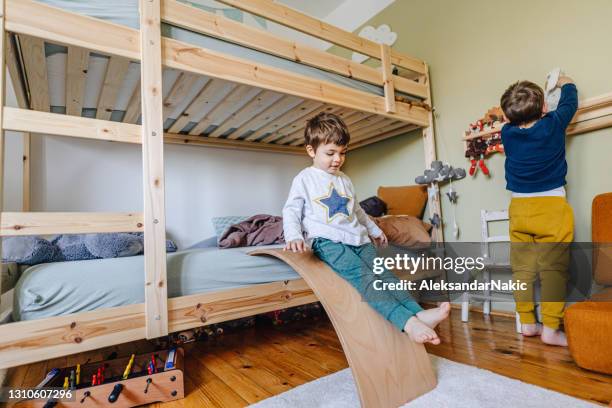 two little boys playing in their room - bunk beds for 3 stock pictures, royalty-free photos & images