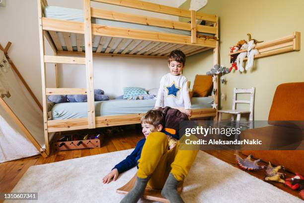 two little boys playing in their room - bunkbed stock pictures, royalty-free photos & images