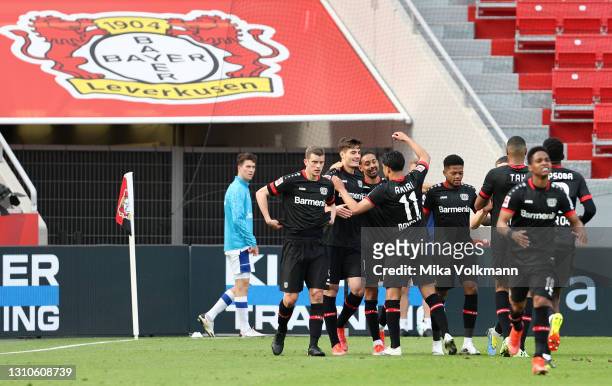 Patrik Schick of Bayer Leverkusen celebrates with Nadiem Amiri and teammates after scoring their team's second goal during the Bundesliga match...