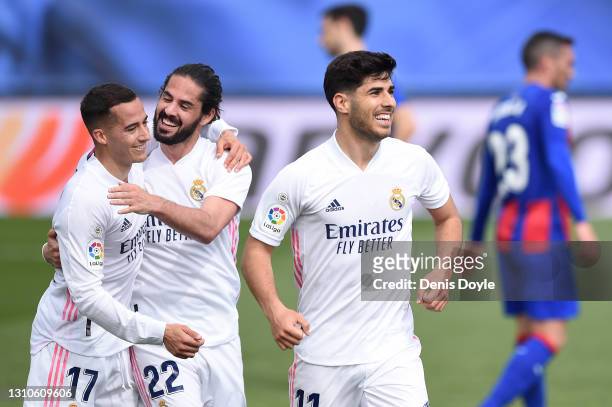 Marco Asensio of Real Madrid celebrates with team mates Lucas Vazquez and Isco after scoring their side's first goal but it is later disallowed...