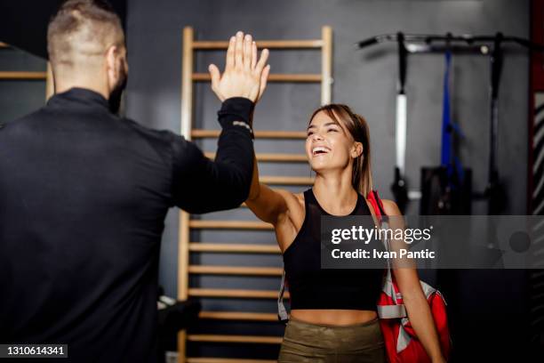 young caucasian woman going to the gym - personal trainer stock pictures, royalty-free photos & images