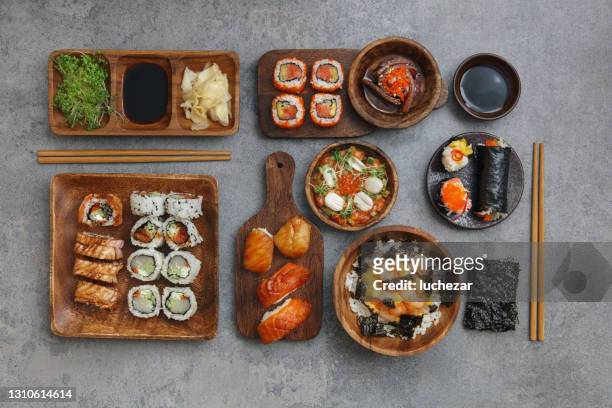 sushi and sushi roll set. rice bowl. gunkan set. tuna tataki. temaki. - japanese food stock pictures, royalty-free photos & images