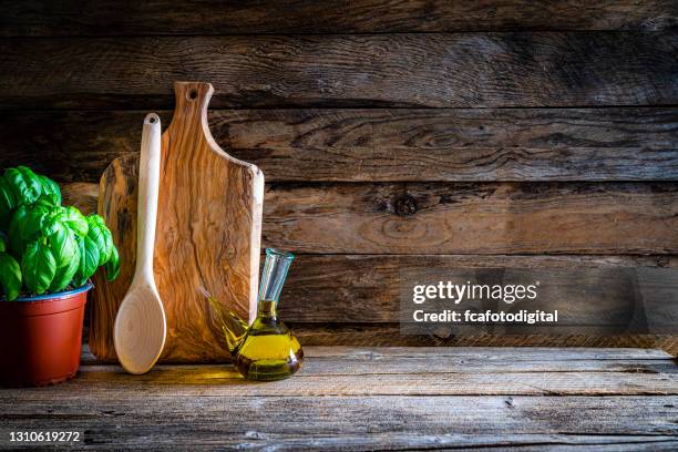 cooking backgrounds: cutting board and kitchen utensils on wooden table. copy space - rustic imagens e fotografias de stock