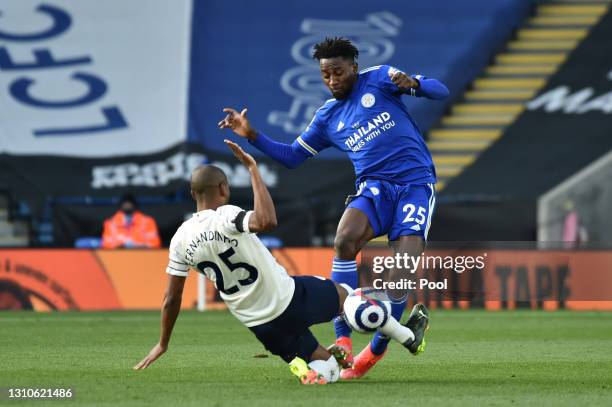 Fernandinho of Manchester City tackles Wilfred Ndidi of Leicester City during the Premier League match between Leicester City and Manchester City at...