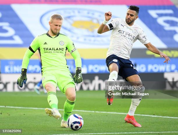 Riyad Mahrez of Manchester City closes down Kasper Schmeichel of Leicester City during the Premier League match between Leicester City and Manchester...