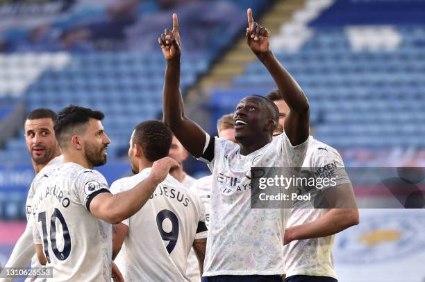 Benjamin Mendy of Manchester City celebrates with Sergio Aguero and teammates after scoring their team's first goal during the Premier League match...