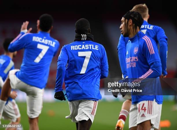 The Arsenal players warm up in David Rocastle tops before the Premier League match between Arsenal and Liverpool at Emirates Stadium on April 03,...