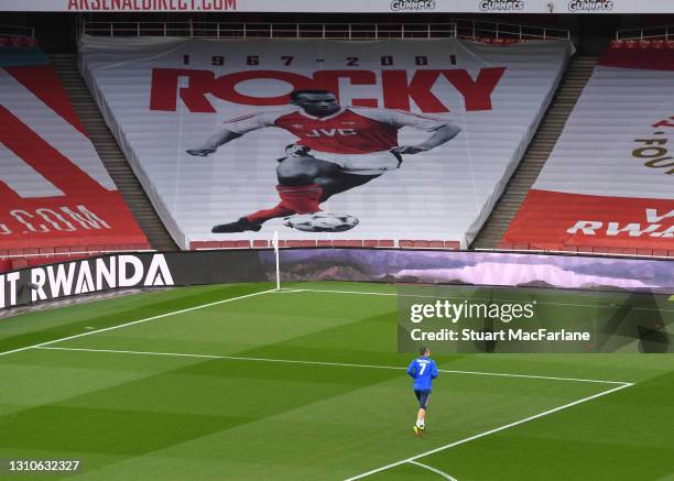 Arsenal goalkeeper Bernd Leno warms up in front of the David Rocastle banner the Premier League match between Arsenal and Liverpool at Emirates...