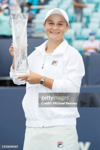 Ashleigh Barty of Australia poses with the winner's trophy after defeating Bianca Andreescu of Canada during the final of the Miami Open at Hard Rock...