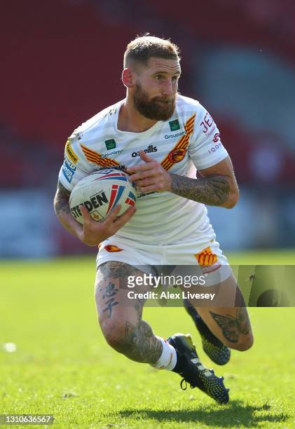 Sam Tomkins of Catalans Dragons collects the ball during the Betfred Super League match between Huddersfield Giants and Catalans Dragons at Totally...