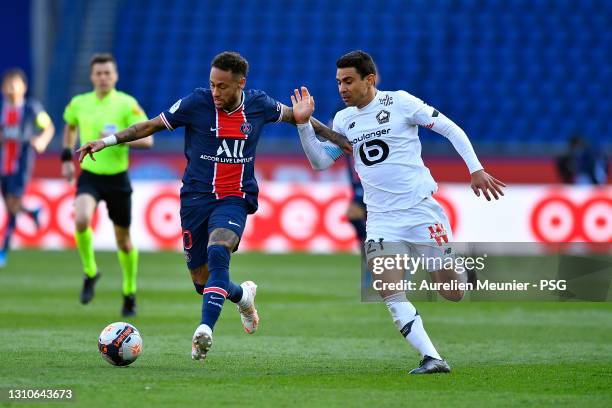 Neymar Jr of Paris Saint-Germain and Benjamin Andre of Lille OSC fight for the ball during the Ligue 1 match between Paris Saint-Germain and Lille...