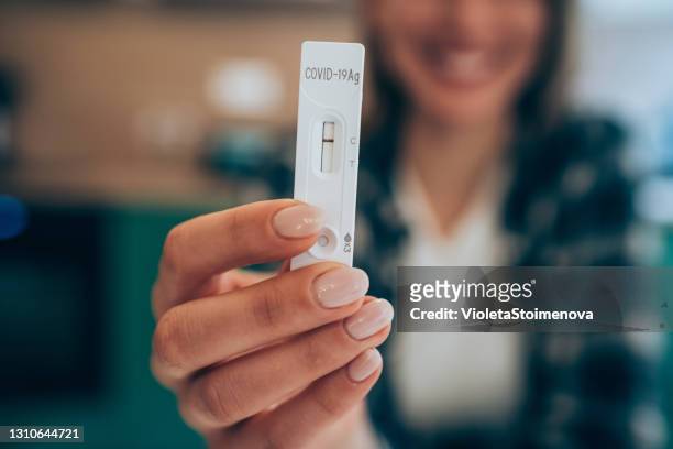 negative test result by using rapid test device for covid-19. - coronavirus stock pictures, royalty-free photos & images