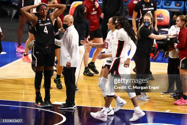 Haley Jones of the Stanford Cardinal and Francesca Belibi of the Stanford Cardinal react with Aliyah Boston of the South Carolina Gamecocks after the...