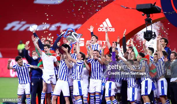 Martin Zubimendi and Mikel Oyarzabal of Real Sociedad lift the trophy after winning the Copa Del Rey Final match between Real Sociedad and Athletic...