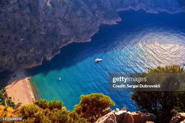 view from the mountain to the blue water surface in butterfly valley, near oludeniz,turkey - blue lagoon imagens e fotografias de stock