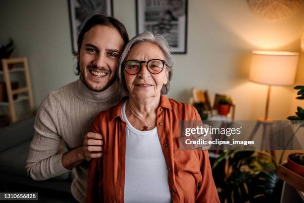 emotions - adult grandson stock pictures, royalty-free photos & images