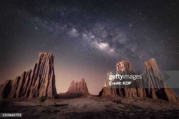 starry night with dramatic milky way galaxy of solar system astronomy. - dramatic landscape stock pictures, royalty-free photos & images