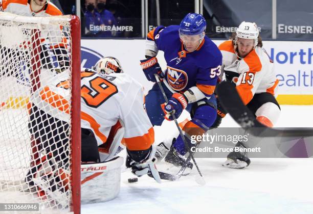 Casey Cizikas of the New York Islanders is stopped during the second period by Carter Hart of the Philadelphia Flyers at the Nassau Coliseum on April...