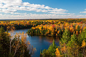 Sunny Highbanks View During Autumn Over The AuSable River Cooke Dam Pond